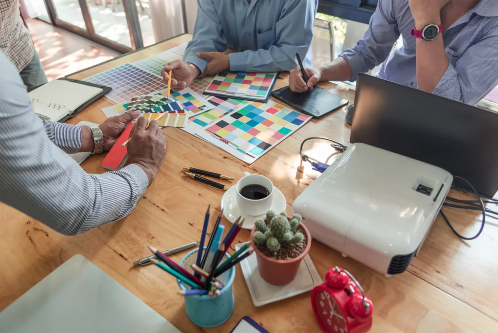 group-asian-designers-brainstorming-working-together-with-colleagues-color-swatches